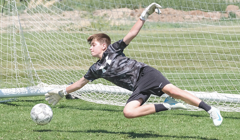Jack Tietema dives down to try saving a ball during the Elite Skills Camp in June. Campers from around Powell and Cody made their way to Northwest College to learn new skills at the weeklong camp.
Tribune photo by Seth Romsa