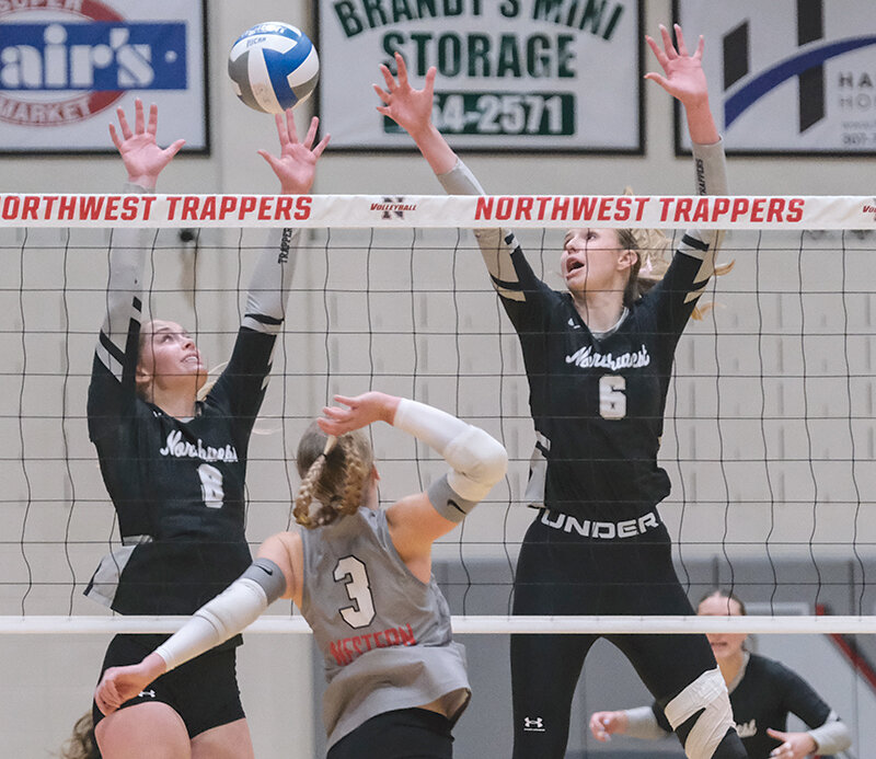 Aidann Mottishaw (left) and Ellianna Baumstarck reach out to block an attempt by Western Wyoming on Friday. Mottishaw and Baumstarck are two of four sophomores who will be leaving the Trapper volleyball program after this season.