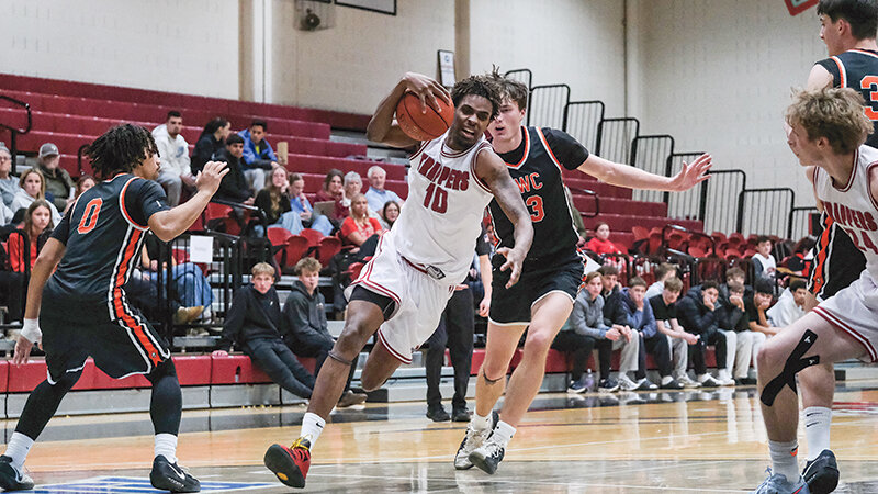 Nayel Girard (left) drives by a Central Wyoming defender. Northwest is guaranteed a top three seed heading into the postseason following two important wins last week.
