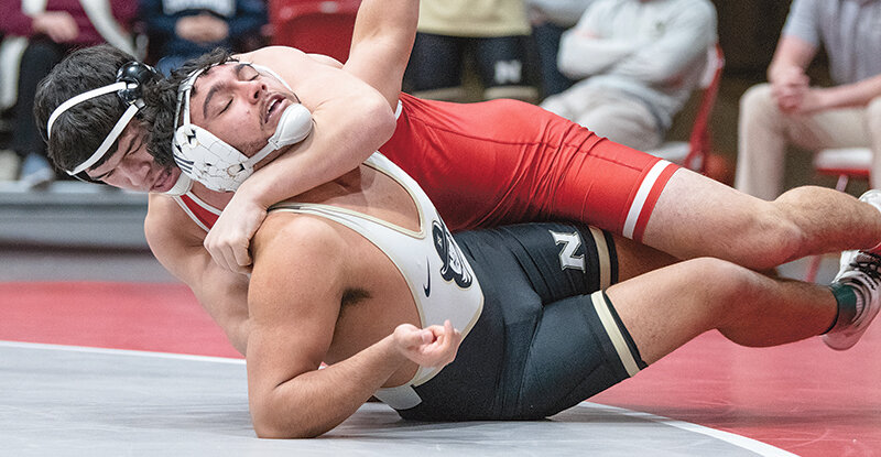 Asad Fayzullaev (top) heads into the national tournament as one of two No. 2 seeds for the Trapper men alongside Austin Richens at 285 pounds.