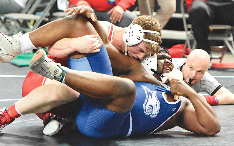 Austin Richens (top) claimed the NJCAA national title at 285 pounds for the Trappers on Saturday in Council Bluffs, Iowa. Richens went 5-0 with four pins and a 5-2 sudden victory, giving him his second straight All-American honors and first individual crown in the championship bout.