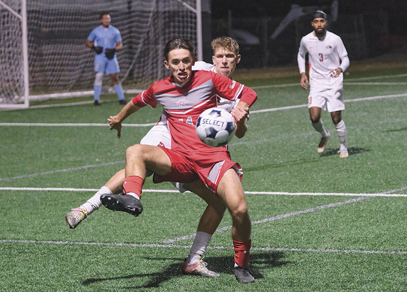 Jack Cuspert holds off a challenge from a Casper College defender during the Trappers' win over the Thunderbirds on Friday.